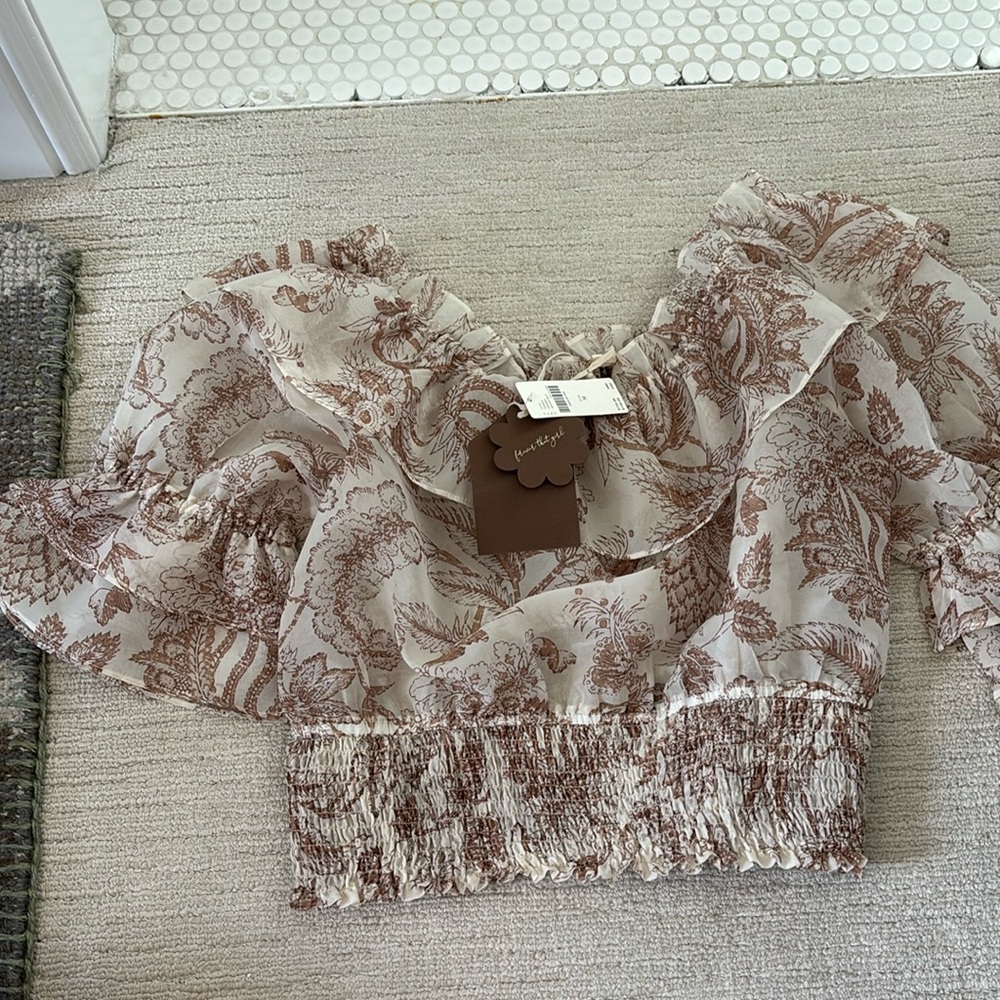 Off thw shoulder brown and cream blouse. Can be dressed up or down .